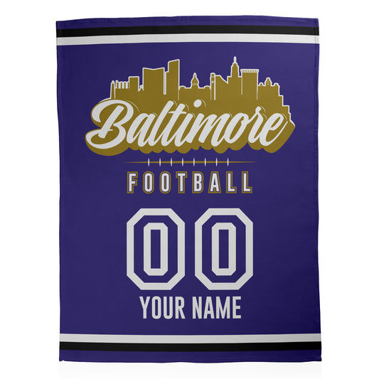Purple and black with gold colors for Baltimore Football design and customizable text printed on a fleece blanket.
