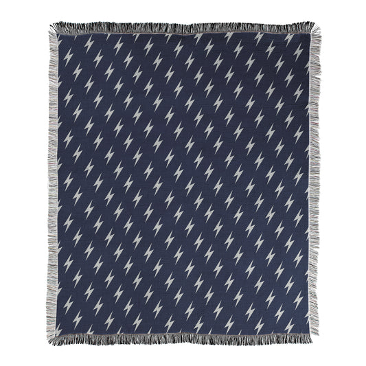 Navy blue background with white lightning bolt pattern printed on a woven cotton/polyester blend blanket.