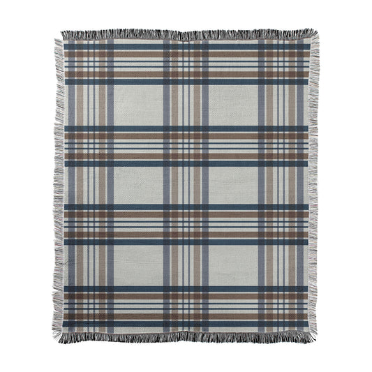 Classic neutral plaid with navy blue and brown with white printed on a woven cotton-polyester blanket with decorative fringed edges.
