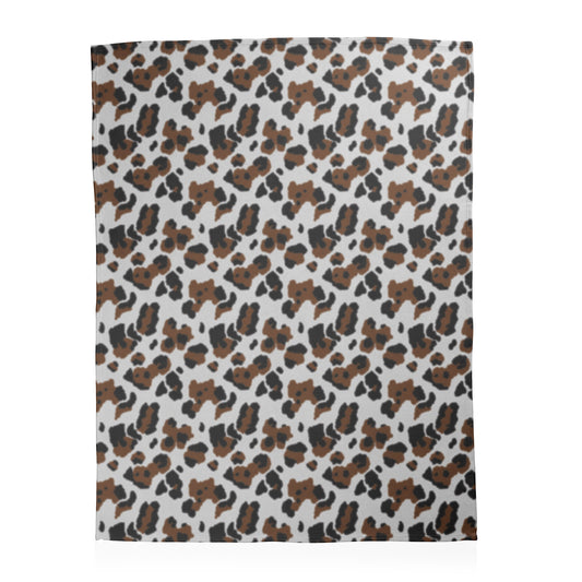 Leopard pattern on a white background printed on a fleece blanket.