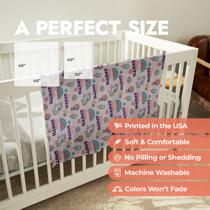 Rainbows and unicorn personalized baby swaddle with product size chart and product features list.