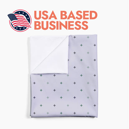 Folded star pattern baby swaddle with header text 'USA Based Business'.