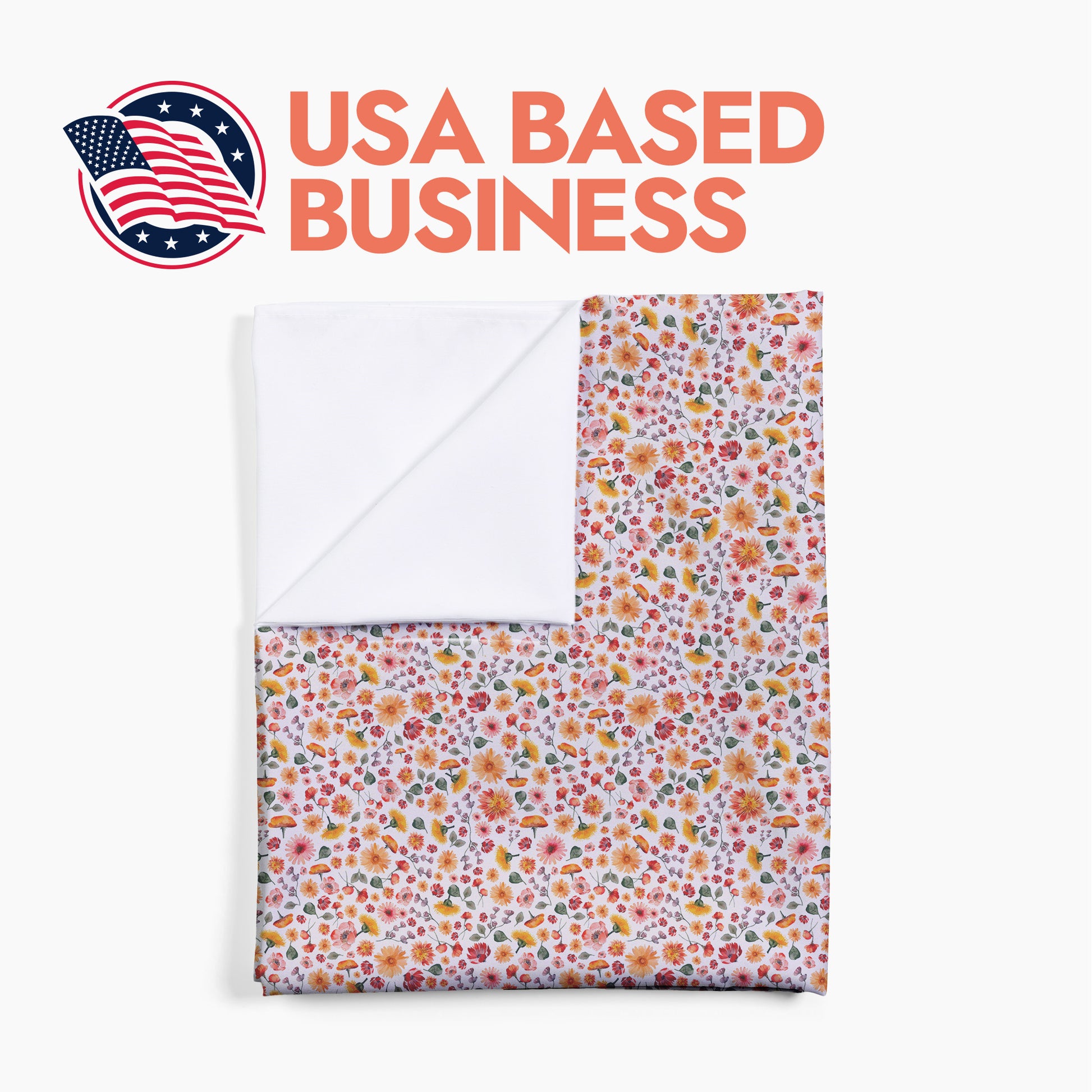 Folded floral-patterned baby swaddle with 'USA Based Business' text