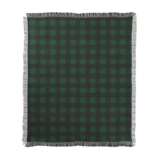 Hunter green and black buffalo checkered pattern printed on a woven cotton-polyester blanket with decorative fringed edges.