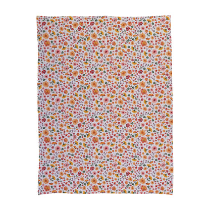 Floral pattern baby swaddle with daisies and small flowers.