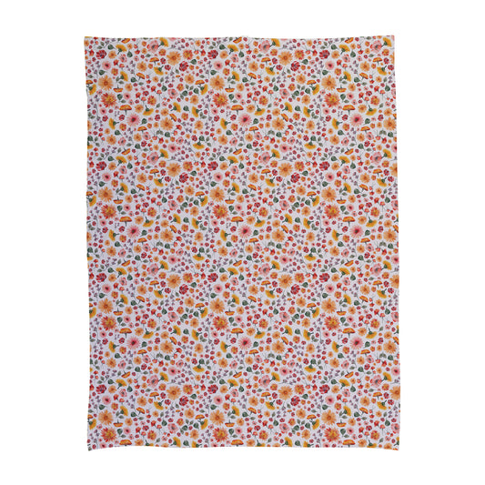 Floral pattern baby swaddle with daisies and small flowers.