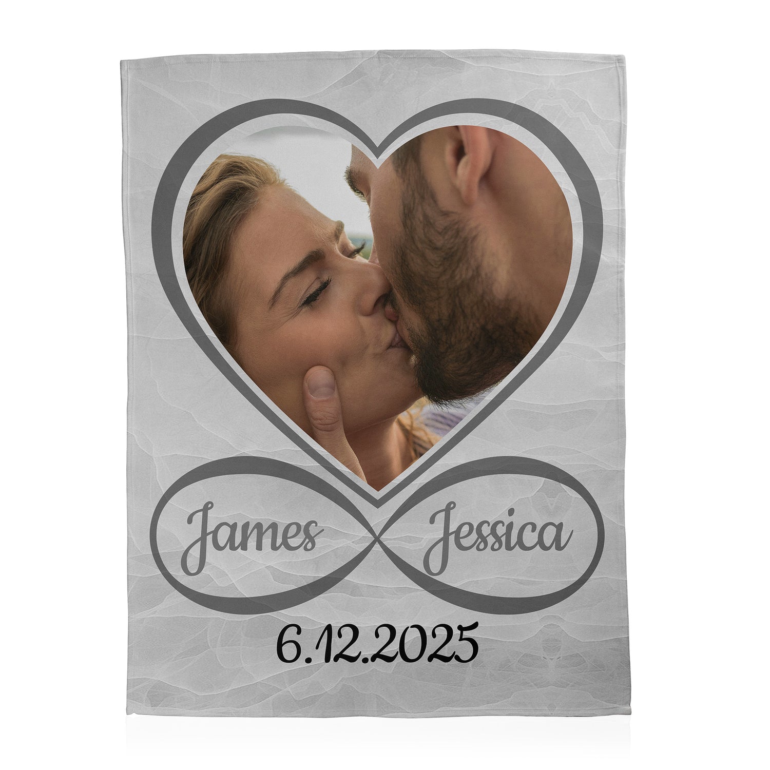 Personalized photo blanket in the shape of a heart with custom text printed on a fleece blanket.