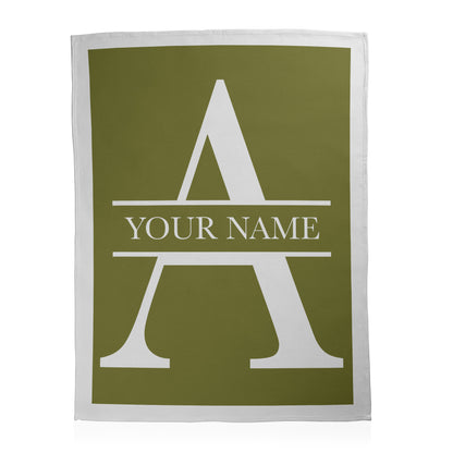 Green blanket with a white letter 'A' and space for 'Your Name' as example text