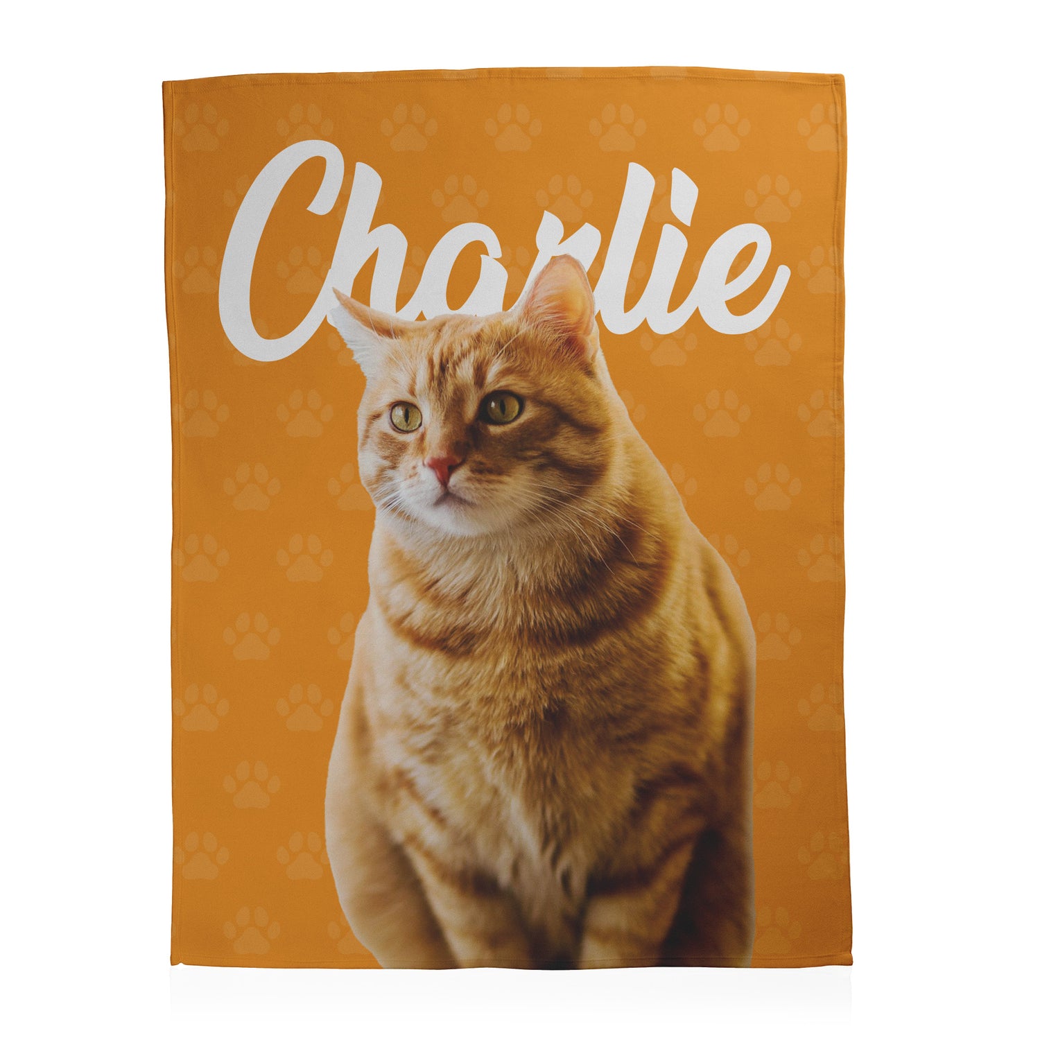 Orange cat with the name 'Charlie' at the top with paw print background printed on an orange fleece blanket.