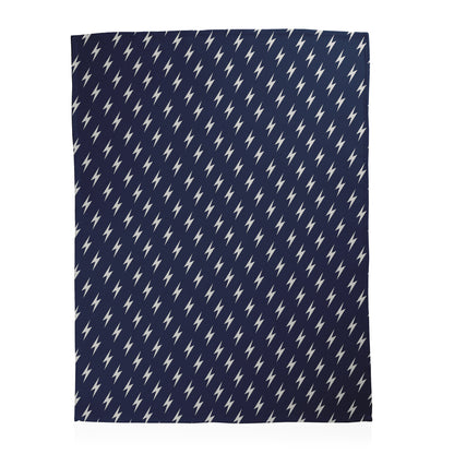Navy blue background with white lightning bolt pattern printed on a fleece blanket.