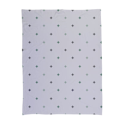 Green and purple star pattern printed on a baby swaddle.