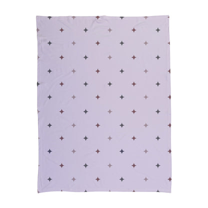 Pink star pattern printed on a baby swaddle.