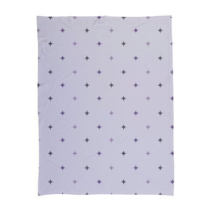 Purple and gray patterned stars printed on a baby swaddle.
