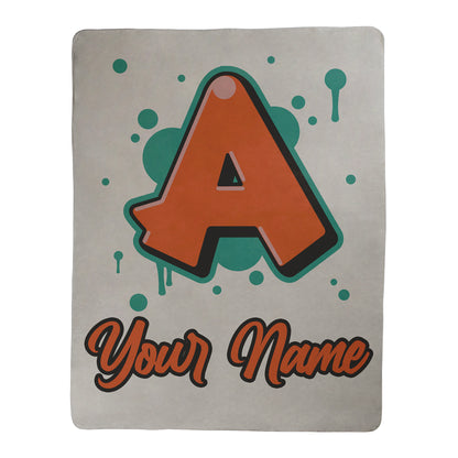Graffiti style design with customization for a letter and text underneath, printed on a white sherpa fleece blanket.