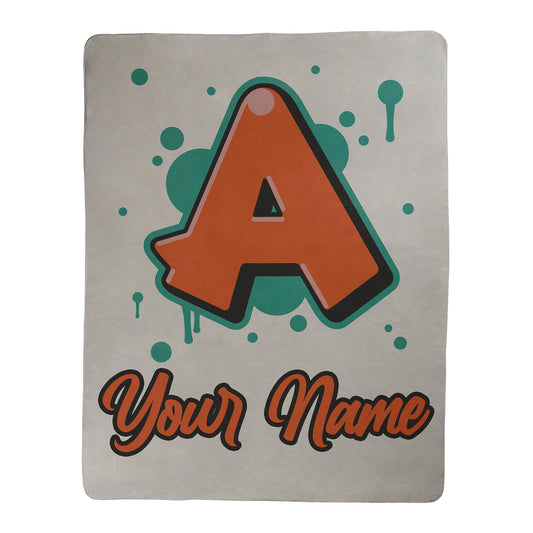 Graffiti style design with customization for a letter and text underneath, printed on a white sherpa fleece blanket.
