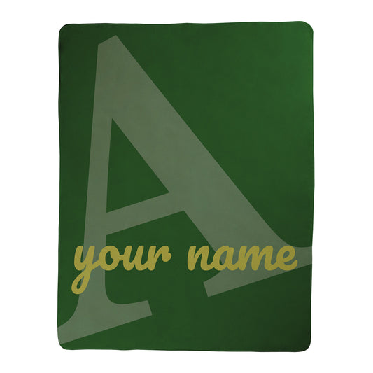 Green blanket with a large letter 'A' and space for 'your name' in yellow text.