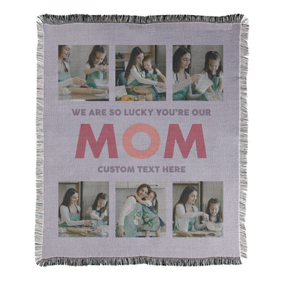 Personalized photo blanket with text 'We are so lucky you're our mom' and placeholder for custom text printed on a woven cotton-polyester blanket with decorative fringed edges.