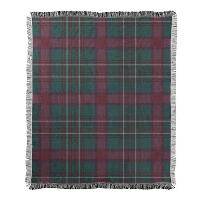 Dark green and wine colored plaid design printed on a woven fleece blanket with decorative fringed edges.