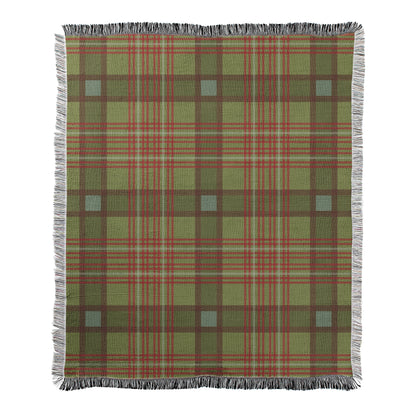 Green and red plaid design printed on a woven fleece blanket with decorative fringed edges.