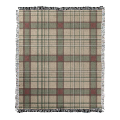 Tan and sage green wit red plaid design printed on a woven fleece blanket with decorative fringed edges.