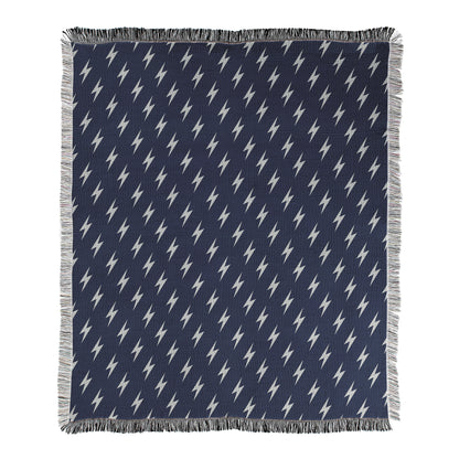 Navy blue background with white lightning bolt pattern printed on a woven cotton/polyester blend blanket.