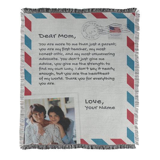 Personalized blanket with letter to mom text and photo printed on a woven cotton-polyester blanket with decorative fringed edges.
