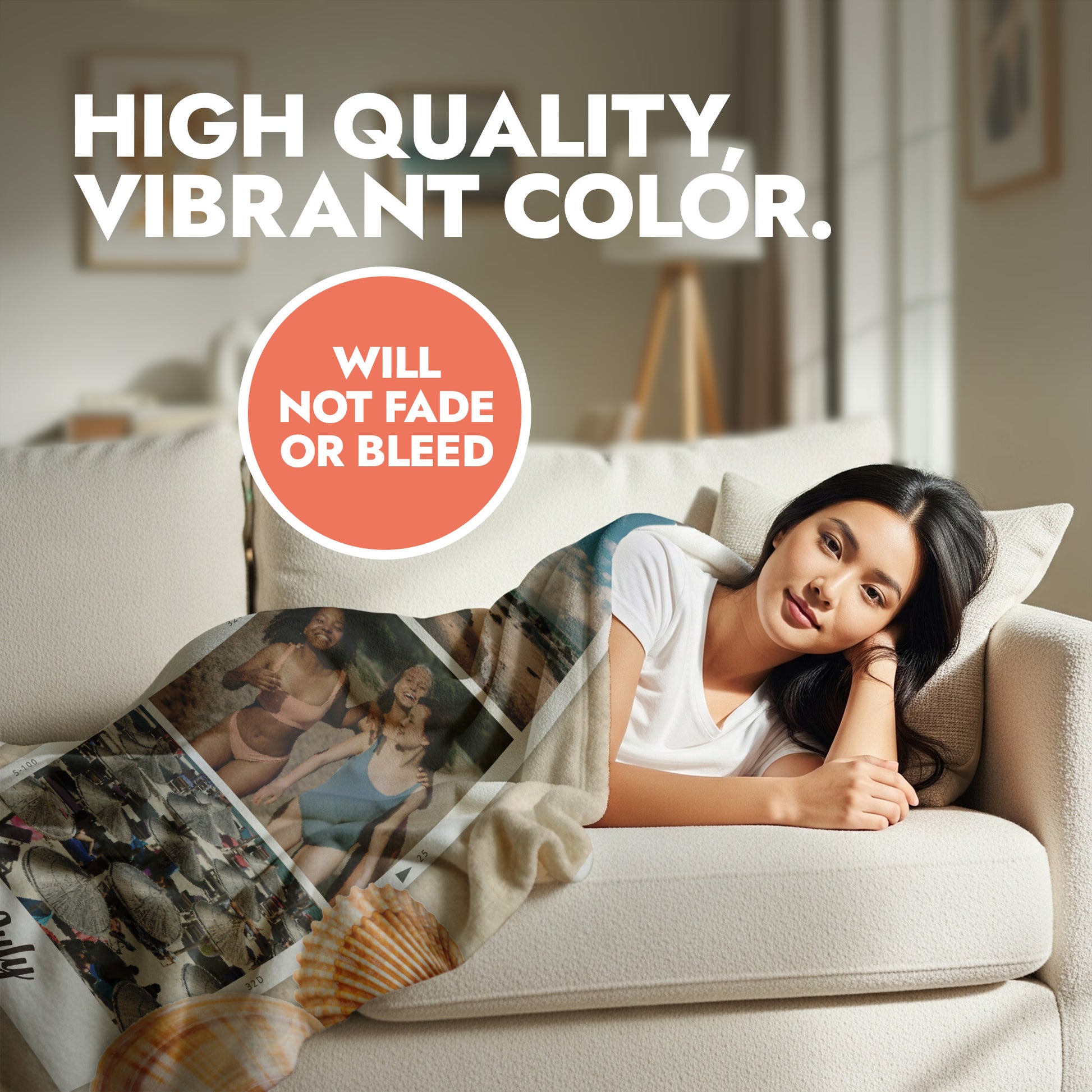 Woman lying on a couch with a blanket featuring images of people, text about high-quality vibrant color, and a promise not to fade or bleed.