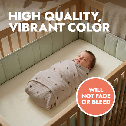 Newborn baby wrapped in a star pattern baby swaddle with header text 'high quality, vibrant color'.