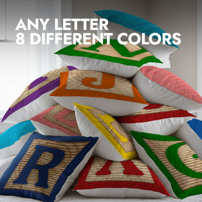 A pile of colorful pillows with wooden block design 